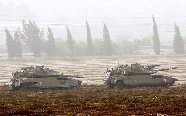 Israeli Merkava tanks stationed near the border with the Gaza Strip in southern Israel, on March 30, 2019. (Jack Guez/ AFP/ File) Israeli Merkava tanks stationed near the border with the Gaza Strip in southern Israel, on March 30, 2019. (Jack Guez/ AFP/ File)
