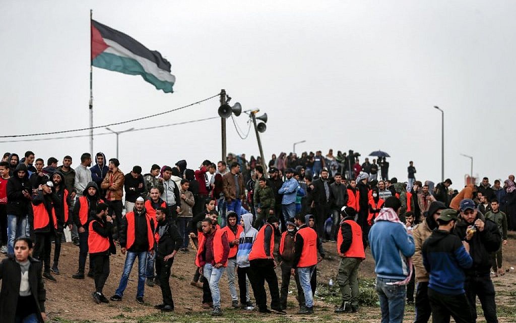 Palestinians gather near the border with Israel in Malaka east of Gaza City on March 30, 2019, as they mark the anniversary of the "March of Return" border protests. (Mahmud Hams/AFP)
