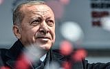 Turkish President Recep Tayyip Erdogan greets his supporters after his speech during a pre-election rally at Bayrampasa district in Istanbul, on March 30, 2019. (Ozan Kose/AFP)