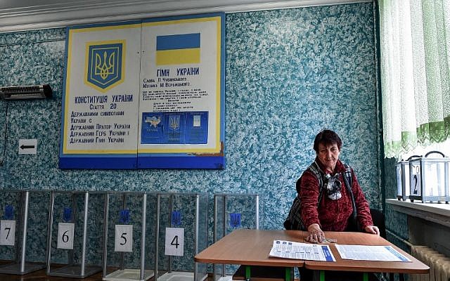 A woman cleans a table where ballots have been prepared at a polling station in the center of Kiev on March 30, 2019 ahead of the Ukrainian presidential election on March 30. (Vasily Maximov/AFP) A woman cleans a table where ballots have been prepared at a polling station in the center of Kiev on March 30, 2019 ahead of the Ukrainian presidential election on March 30. (Vasily Maximov/AFP)