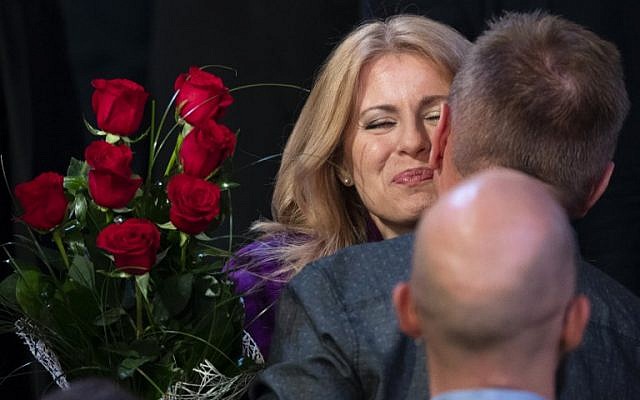 Presidential candidate Zuzana Caputova receives flowers and is congratulated by supporters at her headquarters in Bratislava, Slovakia on March 30, 2019 after taking a big lead in the presidential elections. - Vocal government critic and anti-corruption activist Zuzana Caputova appeared set to become Slovakia's first female president after partial results showed her winning the run-off election of March 30, 2019. Environmental lawyer Caputova got 58.07 percent of the ballot after results from 51 percent of polling stations were counted, while EU energy commissioner Maros Sefcovic garnered 41.92, the Slovak Statistics Office said. (Photo by JOE KLAMAR / AFP) Presidential candidate Zuzana Caputova receives flowers and is congratulated by supporters at her headquarters in Bratislava, Slovakia on March 30, 2019 after taking a big lead in the presidential elections. - Vocal government critic and anti-corruption activist Zuzana Caputova appeared set to become Slovakia's first female president after partial results showed her winning the run-off election of March 30, 2019. Environmental lawyer Caputova got 58.07 percent of the ballot after results from 51 percent of polling stations were counted, while EU energy commissioner Maros Sefcovic garnered 41.92, the Slovak Statistics Office said. (Photo by JOE KLAMAR / AFP)