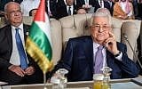 Palestinian Authority President Mahmoud Abbas (R) and and Palestine Liberation Organization Secretary-General Saeb Erekat (L) attend the opening session of the 30th Arab League summit in the Tunisian capital Tunis on March 31, 2019. (Fethi Belaid/Pool/AFP)