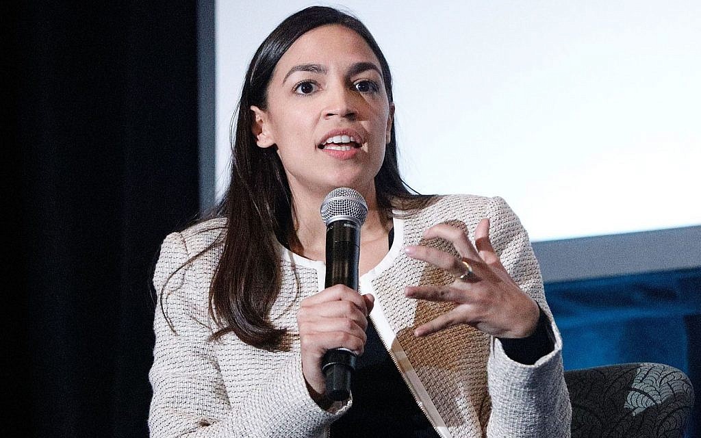 Democratic Representative Alexandria Ocasio-Cortez of New York on stage during the 2019 Athena Film Festival at Barnard College in New York City, March 3, 2019. (Lars Niki/Getty Images for The Athena Film Festival via JTA) Democratic Representative Alexandria Ocasio-Cortez of New York on stage during the 2019 Athena Film Festival at Barnard College in New York City, March 3, 2019. (Lars Niki/Getty Images for The Athena Film Festival via JTA)