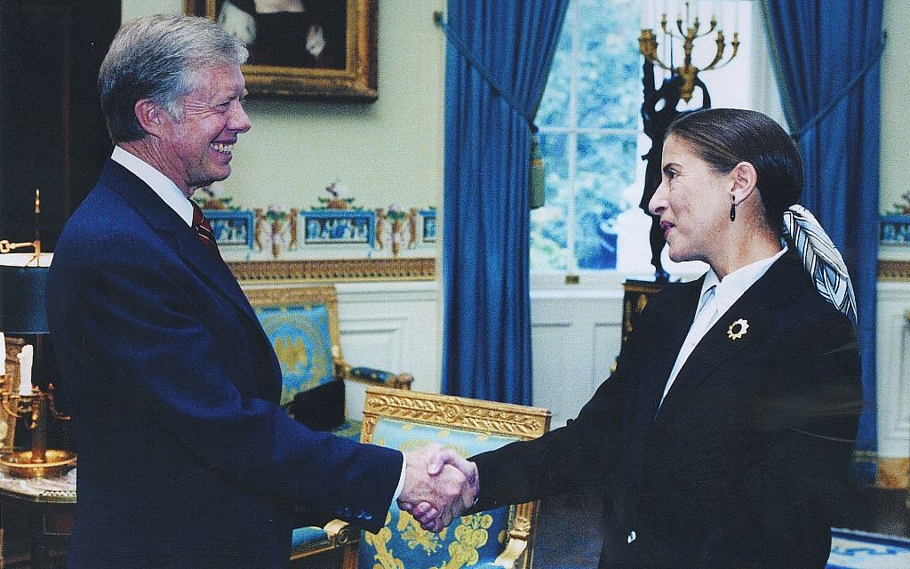 Ruth Bader Ginsburg shakes hands with president Jimmy Carter. (Courtesy Ginsburg)