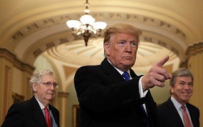 File: US President Donald Trump (C) speaks to reporters with Senate Majority Leader Sen. Mitch McConnell (R-KY) (L), and Sen. Roy Blunt (R-MO) (R), at the US Capitol on March 26, 2019 in Washington, DC. (Alex Wong/Getty Images/AFP)