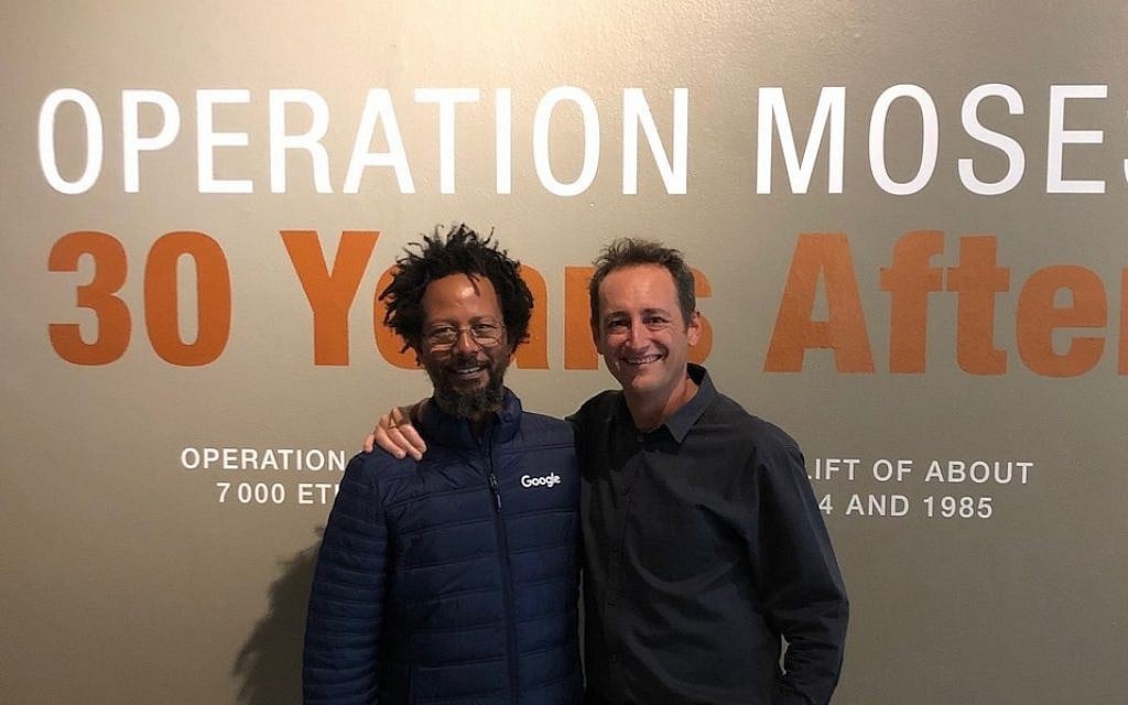 Danny Abebe, left, and Gavin Morris, director of the South African Jewish Museum, at the opening of the Operation Moses exhibition. (Beth Hatfutsot/via JTA)
