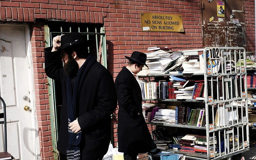 Illustrative: Ultra-Orthodox Jewish men look through books in the neighborhood of Crown Heights on February 25, 2019 in New York City (Spencer Platt/Getty Images via JTA) Illustrative: Ultra-Orthodox Jewish men look through books in the neighborhood of Crown Heights on February 25, 2019 in New York City (Spencer Platt/Getty Images via JTA)