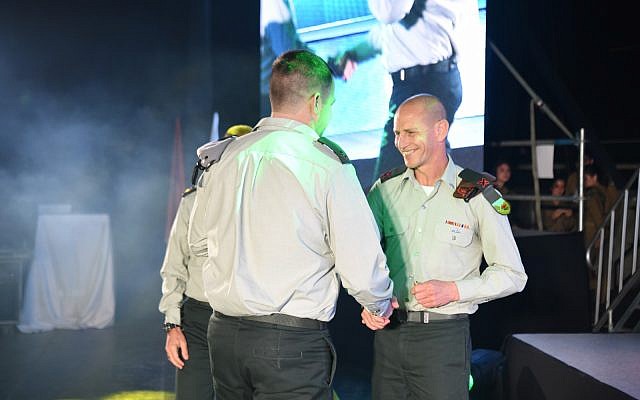 Brigadier-General Rafi Milo, commander of the 91st Galilee Division (right), awards a citation to Major Y of the Engineering Corps for his part in Operation Northern Shield. (IDF) Brigadier-General Rafi Milo, commander of the 91st Galilee Division (right), awards a citation to Major Y of the Engineering Corps for his part in Operation Northern Shield. (IDF)