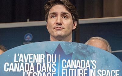Canada's Prime Minister Justin Trudeau announces during a news conference, Thursday, Feb. 28, 2019, at the Canadian Space Agency headquarters in St. Hubert, Quebec, that Canada will take part in an international lunar space station project. (Ryan Remiorz/The Canadian Press via AP)