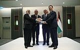 Afghanistan's ambassador to Turkey, Abdul Rahim Sayed, left, presents his nation's $1 million in aid to Pierre Krahenbuhl, right, the Commissioner-General of United Nations Relief and Works Agency for Palestine Refugees, as Turkey's Foreign Minister Mevlut Cavusoglu, 2nd left and Palestinian Foreign Minister Riyad al-Maliki, 2nd right, look on during a ceremony in Istanbul, March 3, 2019. (Lefteris Pitarakis/AP)
