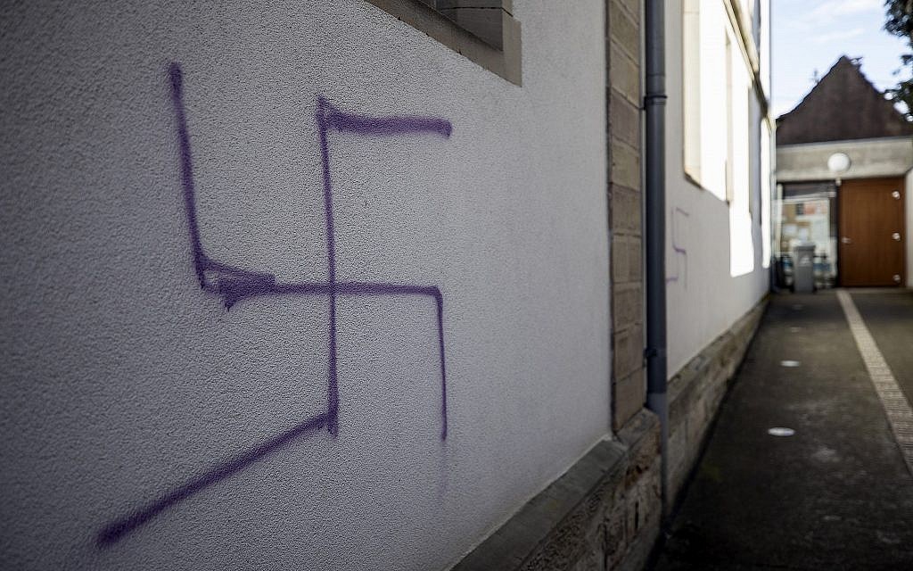 A swastika is seen on a side wall of a former synagogue in Mommenheim, eastern France, March 4, 2019. (AP Photo/Jean-Francois Badias)