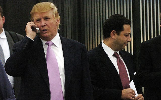 In this photo from September 14, 2005, Donald Trump, left, talks on his cellphone with Felix Sater, right, outside after speaking at the Bixpo 2005 business convention at the Budweiser Events Center in Loveland, Colorado. (Cyrus McCrimmon/The Denver Post via AP) In this photo from September 14, 2005, Donald Trump, left, talks on his cellphone with Felix Sater, right, outside after speaking at the Bixpo 2005 business convention at the Budweiser Events Center in Loveland, Colorado. (Cyrus McCrimmon/The Denver Post via AP)