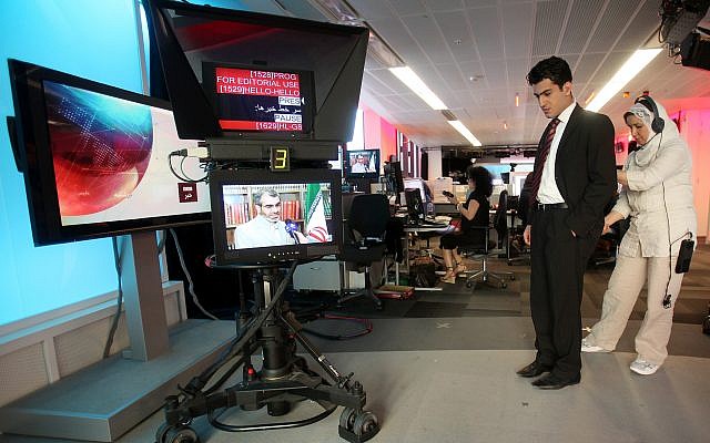 In this June 26, 2009 file photo BBC Persian service presenter Fardad Farahzad, right, gets ready to present the news, at the corporation's London headquarters Inside the studios of BBC Persian television, dozens of journalists have been working around the clock at their computers and telephones, trying to report the news to Iran or, according to the government in Tehran, stirring up trouble. (AP Photo/Simon Dawson,file) In this June 26, 2009 file photo BBC Persian service presenter Fardad Farahzad, right, gets ready to present the news, at the corporation's London headquarters Inside the studios of BBC Persian television, dozens of journalists have been working around the clock at their computers and telephones, trying to report the news to Iran or, according to the government in Tehran, stirring up trouble. (AP Photo/Simon Dawson,file)
