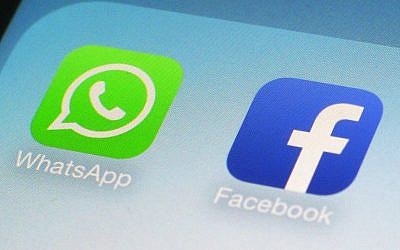 This file photo from February 19, 2014, shows WhatsApp and Facebook app icons on a smartphone. (AP/Patrick Sison)