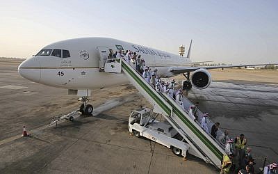 ILLUSTRATIVE - Passengers disembark from a plane belonging to Saudia airlines, at Baghdad International Airport, in Iraq, Oct. 19, 2017 (AP Photo/Karim Kadim)