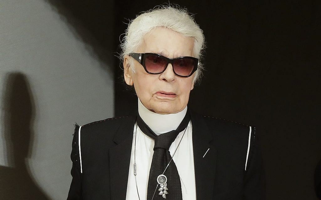 Fashion designer Karl Lagerfeld walks over the stage at Chanel's pre-fall Metiers d'Art fashion show in the new Elbphilharmonie concert house in Hamburg, northern Germany, Wednesday, December 6, 2017. (AP Photo/Markus Schreiber) Fashion designer Karl Lagerfeld walks over the stage at Chanel's pre-fall Metiers d'Art fashion show in the new Elbphilharmonie concert house in Hamburg, northern Germany, Wednesday, December 6, 2017. (AP Photo/Markus Schreiber)