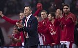 Olympiakos coach David Blatt celebrates a point during a Euroleague basketball match between Panathinaikos and Olympiakos in Piraeus near Athens, on January 4, 2019. (AP Photo/Petros Giannakouris)