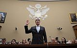 Michael Cohen, US President Donald Trump's former personal lawyer, is sworn in to testify before the House Oversight and Reform Committee on Capitol Hill in Washington, February 27, 2019. (J. Scott Applewhite/AP)