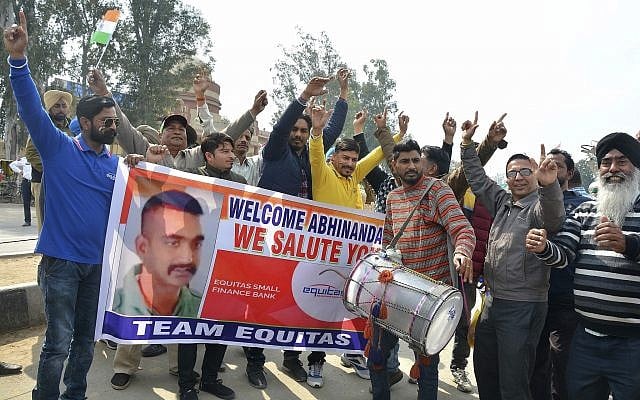 Indians dance as they wait to welcome Indian fighter pilot Wing Commander Abhinandan Varthaman at India Pakistan border at Wagah, 28 kilometers (17.5 miles) from Amritsar, India, March 1, 2019. (AP Photo/Prabhjot Gill) Indians dance as they wait to welcome Indian fighter pilot Wing Commander Abhinandan Varthaman at India Pakistan border at Wagah, 28 kilometers (17.5 miles) from Amritsar, India, March 1, 2019. (AP Photo/Prabhjot Gill)