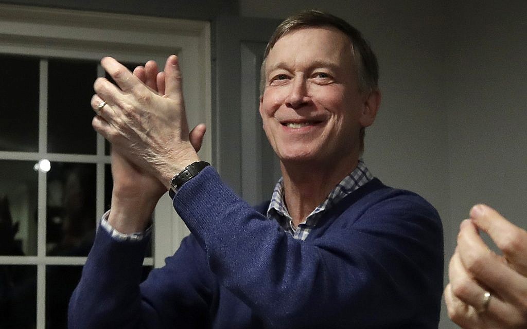 In this Feb. 13, 2019, file photo, former Colorado Gov. John Hickenlooper, left, applauds at a campaign house party, in Manchester, N.H. Hickenlooper is running for president, becoming the second governor to jump into the sprawling Democratic 2020 contest. Hickenlooper is a former brewpub owner and Denver mayor who hopes his two terms governing a swing state shows that he can unite the country. (AP Photo/Elise Amendola, File) In this Feb. 13, 2019, file photo, former Colorado Gov. John Hickenlooper, left, applauds at a campaign house party, in Manchester, N.H. Hickenlooper is running for president, becoming the second governor to jump into the sprawling Democratic 2020 contest. Hickenlooper is a former brewpub owner and Denver mayor who hopes his two terms governing a swing state shows that he can unite the country. (AP Photo/Elise Amendola, File)