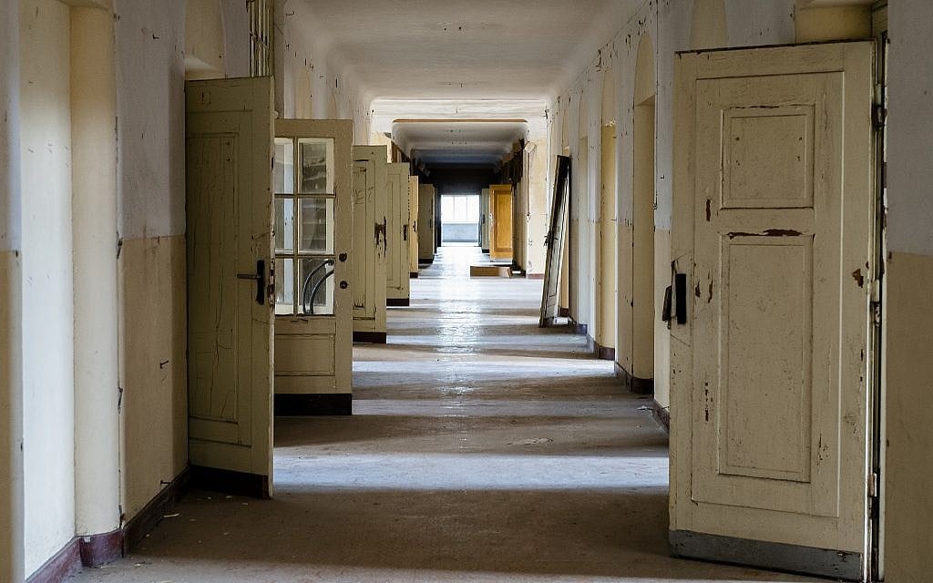 In this Tuesday, Feb. 22, 2019 photo, the doors stand open in a corridor of the abandoned "Haus der Offiziere", the headquarters for the Soviets' military high command in former East Germany at the Wuensdorf neighborhood of Zossen, some 40 kilometers (25 miles) south of Berlin.  (AP/Markus Schreiber)