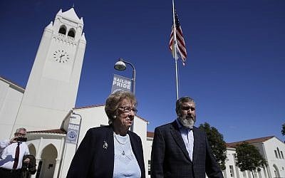 Eva Schloss, left, the stepsister of Anne Frank and a Holocaust survivor, and Rabbi Reuven Mintz leave Newport Harbor High School after a meeting with a group of students Thursday, March 7, 2019, in Newport Beach, Calif. (AP/Jae C. Hong)