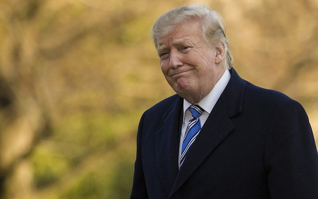 US President Donald Trump smiles as he walks on the South Lawn after stepping off Marine One at the White House, in Washington, March 10, 2019. (Alex Brandon/AP) US President Donald Trump smiles as he walks on the South Lawn after stepping off Marine One at the White House, in Washington, March 10, 2019. (Alex Brandon/AP)