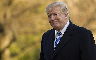 US President Donald Trump smiles as he walks on the South Lawn after stepping off Marine One at the White House, in Washington, March 10, 2019. (Alex Brandon/AP)