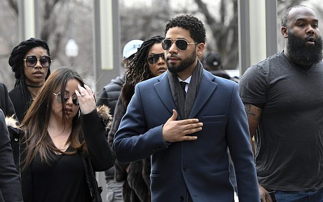 Empire actor Jussie Smollett, center, arrives at the Leighton Criminal Court Building for his hearing on March 14, 2019, in Chicago (AP Photo/Matt Marton) Empire actor Jussie Smollett, center, arrives at the Leighton Criminal Court Building for his hearing on March 14, 2019, in Chicago (AP Photo/Matt Marton)