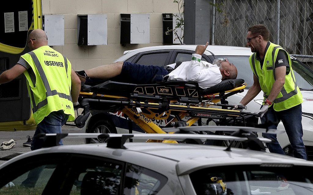 Ambulance staff take a man from outside a mosque in central Christchurch, New Zealand, Friday, March 15, 2019. A witness says many people have been killed in a mass shooting at a mosque in the New Zealand city of Christchurch.(AP Photo/Mark Baker)