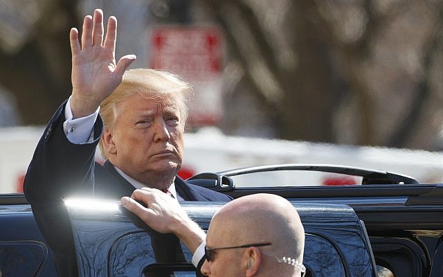 US President Donald Trump waves as he boards his motorcade vehicle after he and First Lady Melania Trump attend a service at Saint John's Church in Washington, DC, March 17, 2019. (AP Photo/Carolyn Kaster) US President Donald Trump waves as he boards his motorcade vehicle after he and First Lady Melania Trump attend a service at Saint John's Church in Washington, DC, March 17, 2019. (AP Photo/Carolyn Kaster)