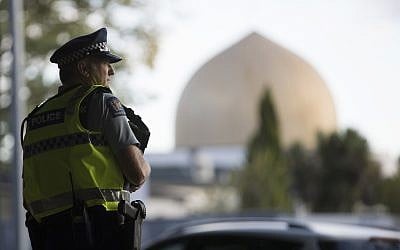A police official stands guard in front of the Al Noor mosque in Christchurch, New Zealand, March 19, 2019. (AP Photo/Vincent Thian)