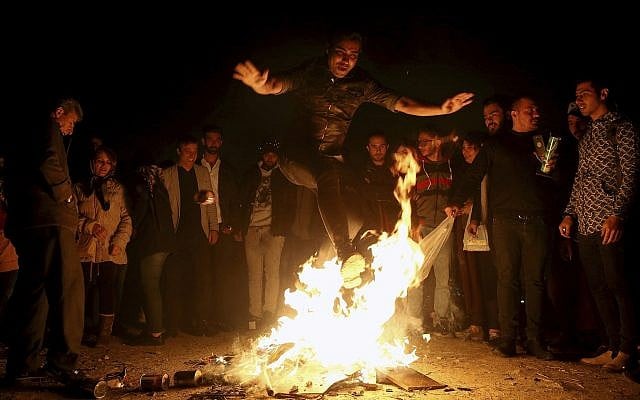 An Iranian man jumps over a bonfire March 19, 2019 in Tehran as Iranians observed a nearly 4,000-year-old Persian tradition known as the Festival of Fire. (AP/Ebrahim Noroozi) An Iranian man jumps over a bonfire March 19, 2019 in Tehran as Iranians observed a nearly 4,000-year-old Persian tradition known as the Festival of Fire. (AP/Ebrahim Noroozi)