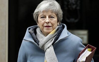 Britain's Prime Minister Theresa May leaves 10 Downing Street to attend the weekly Prime Ministers' Questions session, at parliament in London, March 20, 2019. (AP Photo/Matt Dunham)