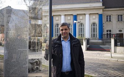 Palestinian-German politician Raed Saleh poses for a photo near a remembrance plague with information and a photo of the former Fraenkelufer synagogue, in Berlin, March 20, 2019.(AP Photo/Markus Schreiber)