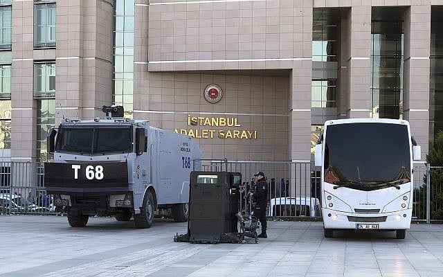 Security cars and a police officer outside Istanbul's courthouse during the trial of Metin Topuz, a Turkish employee of the United States Consulate in Istanbul charged with espionage, March 26, 2019. (AP/Mehet Guzel) Security cars and a police officer outside Istanbul's courthouse during the trial of Metin Topuz, a Turkish employee of the United States Consulate in Istanbul charged with espionage, March 26, 2019. (AP/Mehet Guzel)