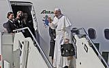 Pope Francis waves as he boards the airplane for Rabat, Morocco at Rome's Fiumicino International airport, Saturday, March 30, 2019 (AP Photo/Alessandra Tarantino)