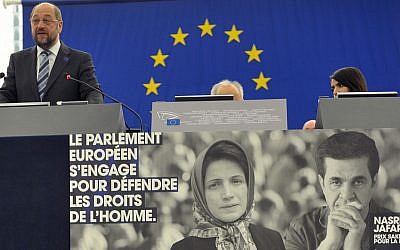 Martin Schultz, top left, president of the European Parliament delivers a statement during the awarding ceremony for the Sakharov Prize Wednesday, Dec 12, 2012 at the European Parliament in Strasbourg, eastern France, in front of pictures of Nasrin Sotoudeh and film director Jafar Panahi. (AP/Christian Lutz)