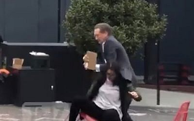 Larry Baer seen in a physical altercation with his wife Pam, in a video published March 1, 2019. (screen capture: TMZ)