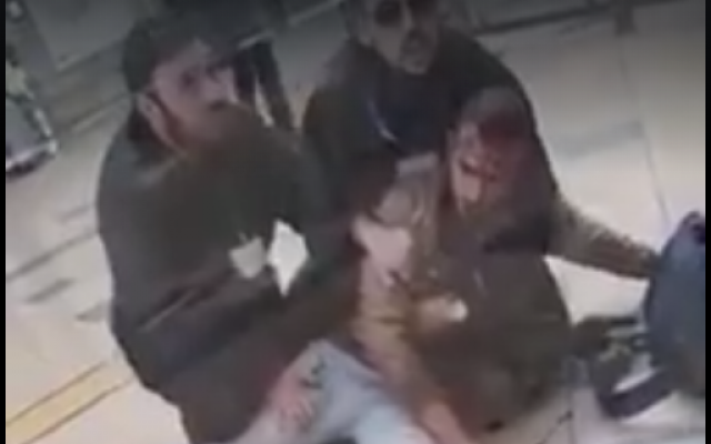 A Bedouin soldier is held by two security guards at a train in Beersheba on March 3, 2019, after the guards reportedly beat him for refusing to show his ID. (Screen capture: Facebook) A Bedouin soldier is held by two security guards at a train in Beersheba on March 3, 2019, after the guards reportedly beat him for refusing to show his ID. (Screen capture: Facebook)