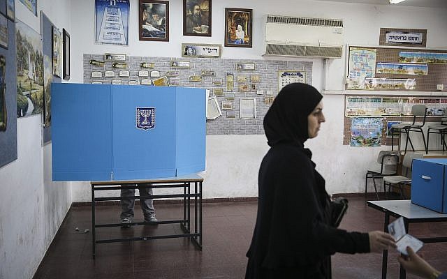 Illustrative: Arab-Israeli citizens cast their votes at a polling station in Ramla on elections day for the 20th Knesset, March 17, 2015. (Hadas Parush/Flash90) Illustrative: Arab-Israeli citizens cast their votes at a polling station in Ramla on elections day for the 20th Knesset, March 17, 2015. (Hadas Parush/Flash90)