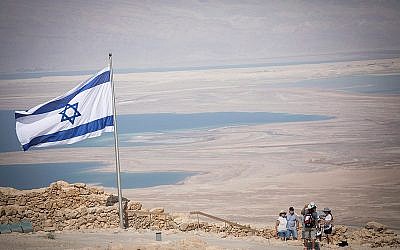 People tour Mount Masada, near the Dead Sea in southern Israel, on July 19, 2018. (Yonatan Sindel/Flash90) People tour Mount Masada, near the Dead Sea in southern Israel, on July 19, 2018. (Yonatan Sindel/Flash90)