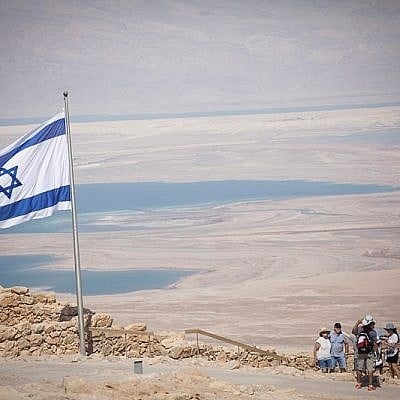 People tour Mount Masada, near the Dead Sea in southern Israel, on July 19, 2018. (Yonatan Sindel/Flash90) People tour Mount Masada, near the Dead Sea in southern Israel, on July 19, 2018. (Yonatan Sindel/Flash90)