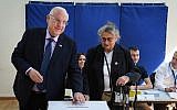President Reuven Rivlin and his wife Nechama cast their ballots at a voting station on the morning of the municipal elections, on October 30, 2018, in Jerusalem. (Mark Neyman/GPO)