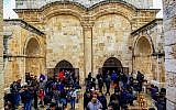 Palestinians take part in Friday prayers outside the Golden Gate, or Gate of Mercy entrance to the Temple Mount compound in Jerusalem's Old City, on March 1, 2019. (Sliman Khader/Flash90)