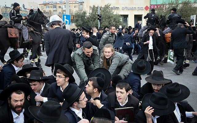 An ultra-Orthodox demonstration against the arrest of an IDF draft-dodger in Jerusalem on March 7, 2019. (Noam Revkin Fenton/Flash90) An ultra-Orthodox demonstration against the arrest of an IDF draft-dodger in Jerusalem on March 7, 2019. (Noam Revkin Fenton/Flash90)