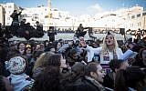 Members of the Women of the Wall movement hold monthly prayers as thousands of ultra-Orthodox women protest against them at the Western Wall in Jerusalem Old City, March 8, 2019. (Hadas Parush/Flash90)