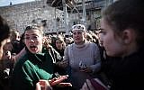 Members of the Women of the Wall movement hold Rosh Hodesh prayers as thousands of ultra-Orthodox women protest against them at the Western Wall in Jerusalem Old City, March 8, 2019. (Hadas Parush/Flash90)