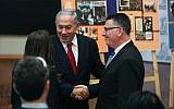 Prime Minister Benjamin Netanyahu shakes hands with Likud candidate Gideon Sa'ar as he arrives for a Likud faction meeting at the Menachem Begin Heritage Center in Jerusalem on March 11, 2019. (Yonatan Sindel/Flash90)