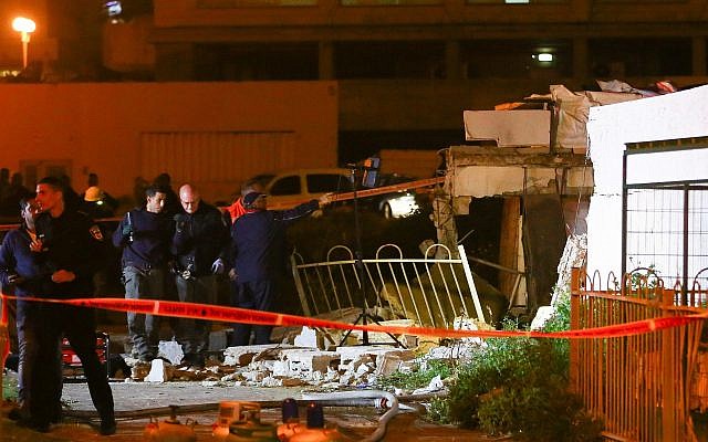 Police at the scene of a gas balloon explosion at a building in Ashdod, southern Israel, March 14, 2019. (Flash90) Police at the scene of a gas balloon explosion at a building in Ashdod, southern Israel, March 14, 2019. (Flash90)